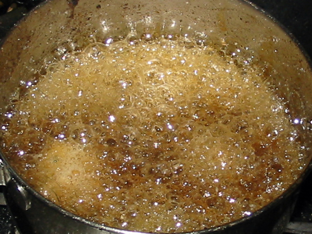 Falafels being deep-fried in hot oil