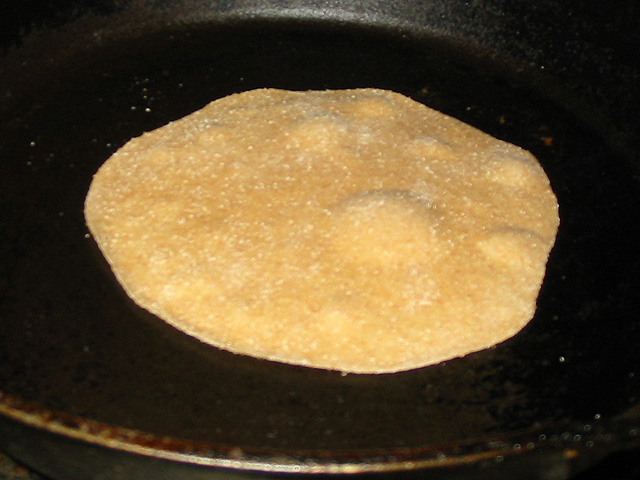 Roti beginning to bubble in skillet