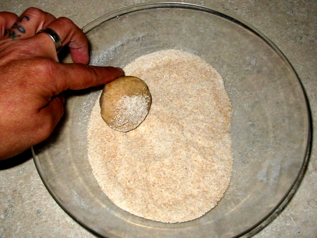 Rolling Roti dough balls in flour